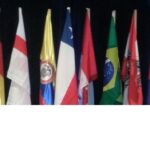 World Rescue Organisation logo and a backdrop of various international flags