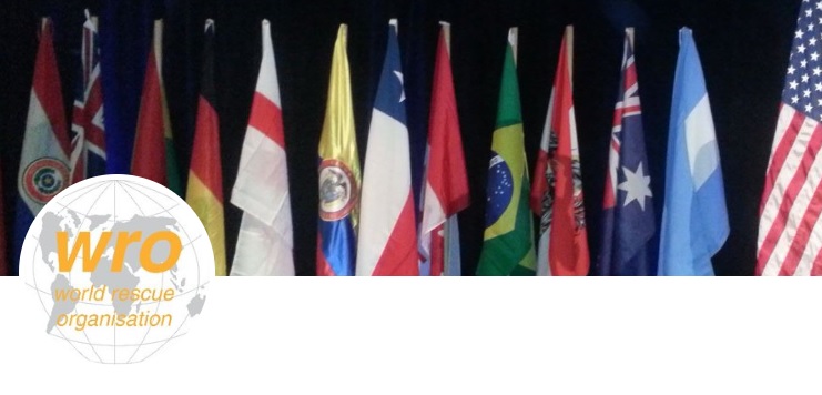 World Rescue Organisation logo and a backdrop of various international flags
